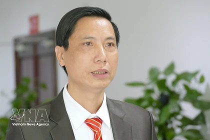 Le Van Thuy, vice-président de l’Association générale des Vietnamiens au Laos, répond à une interview de la VNA. Photo: VNA