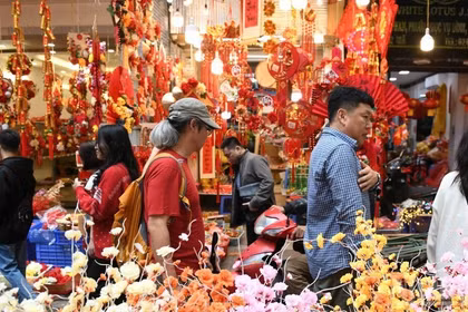 Les Vietnamiens profiteront de neuf jours de congé pour célébrer le Têt à leur manière. 